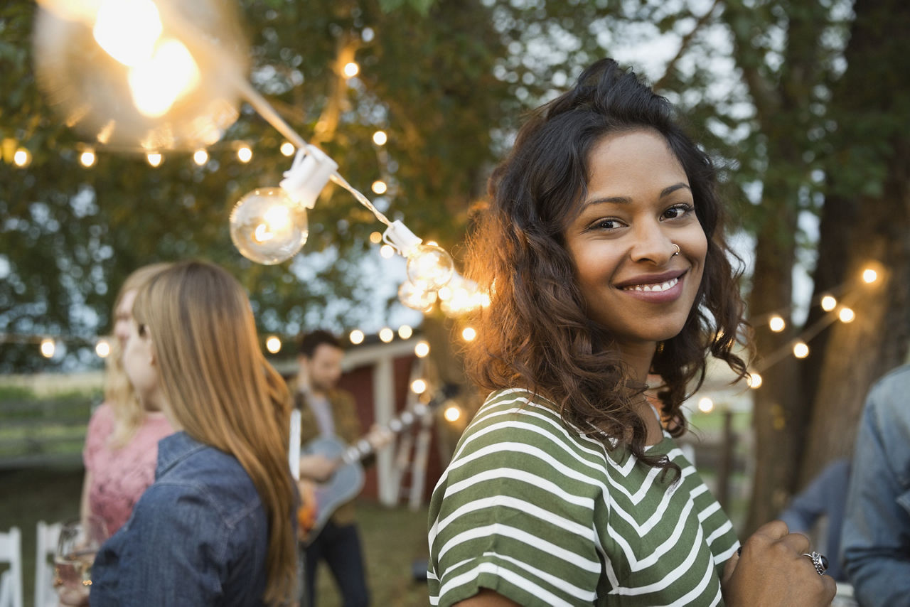 Smiling woman at an outdoor party