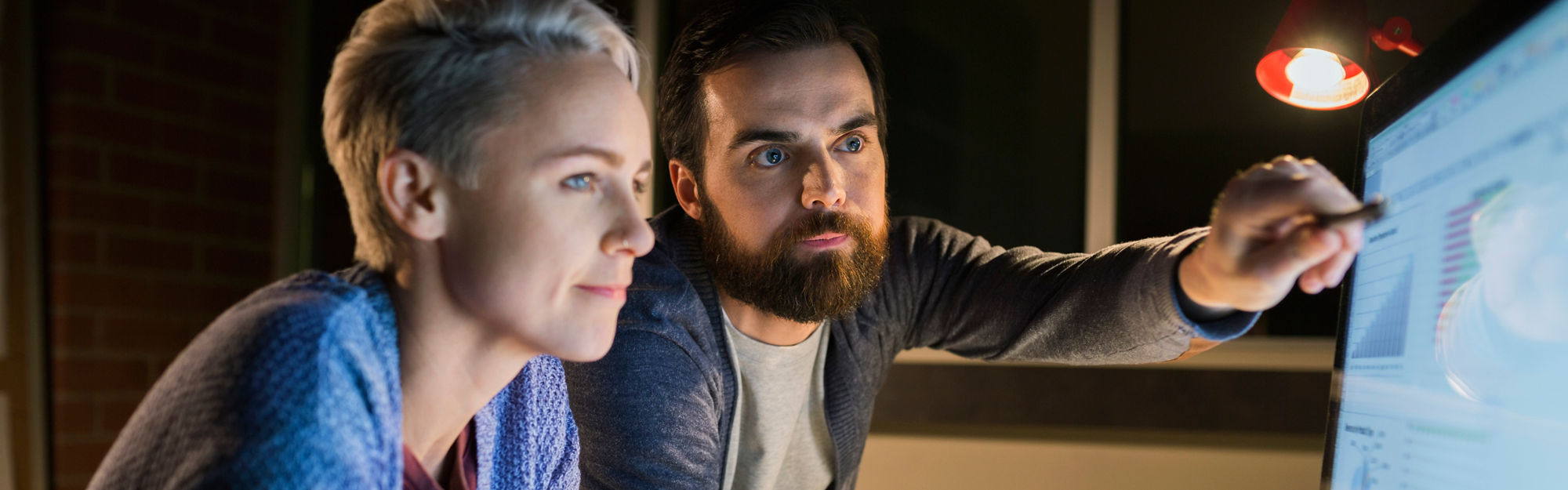 Woman and man looking at a computer screen