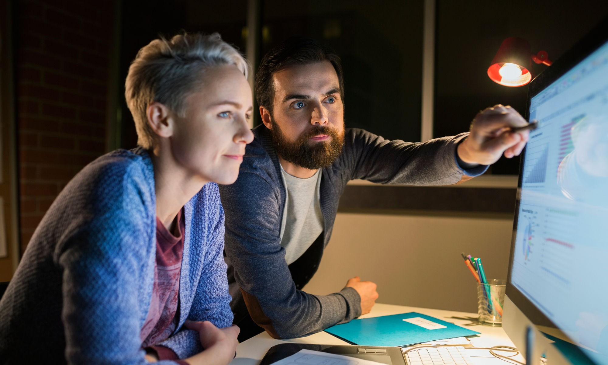 Woman and man looking at a computer screen