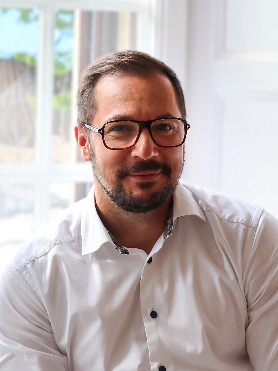 Medarbetare John Komlosi