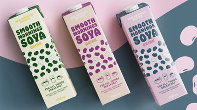 3 carton packages with soya beverage, artistic background