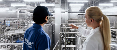 two women in a factory environment