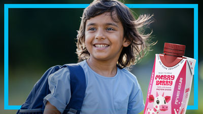 Young boy with backpack, protein drink in Tetra Prisma Aseptic carton 