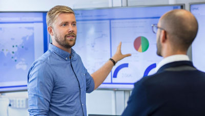 man showing chart on a futuristic dashboard