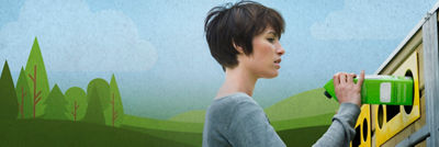 Woman recycling a carton in a recycling bin