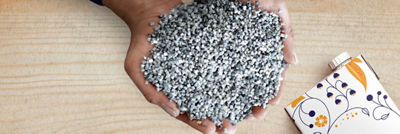 Hands filled with recycled polymers