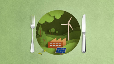 Teller aus Karton mit Windenergieanlage und Werk