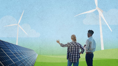 Experts looking at solar panels and windmills