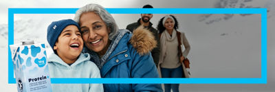 Grandma and family and protein drink in Tetra Brik Aseptic carton