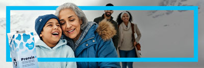 Grandma and family and protein drink in Tetra Brik Aseptic carton