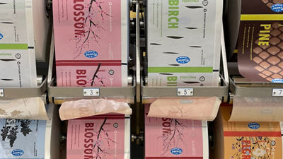 Rolls of printed ice cream packaging in different colours and designs.