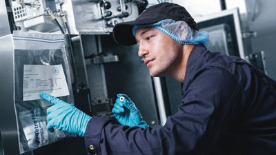 man fixing and reading machine