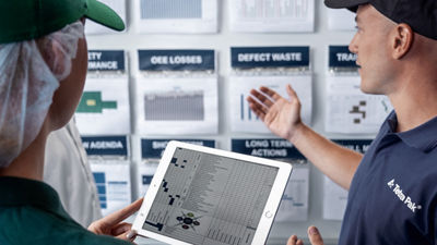 man pointing at data on the wall