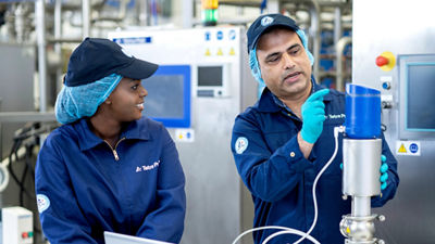 man and woman pointing at part 