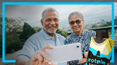 Elderly couple taking selfie, protein drink in Tetra Prisma Aseptic carton package