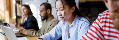 Woman working on her laptop in an office