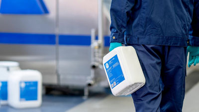 person walking with jug