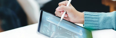 Woman designing carton a tablet