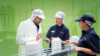 Two men next to a table