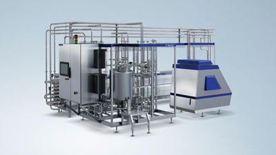 Tetra Pak indirect UHT processing unit featuring stainless steel pipes, tanks and control equipment against a light blue background.