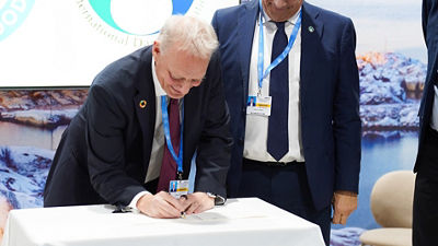 man signing a decleration