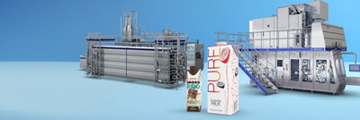 Aseptic cartons, heat exchanger and filling machine in background