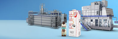 Tetra Brik Aseptic cartons, heat exchanger and filling machine in background