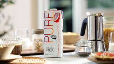 Breakfast table, white milk in Tetra Pak carton package
