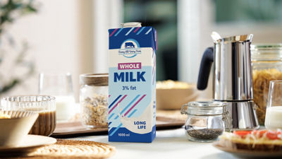 Breakfast table, white milk in Tetra Pak carton package