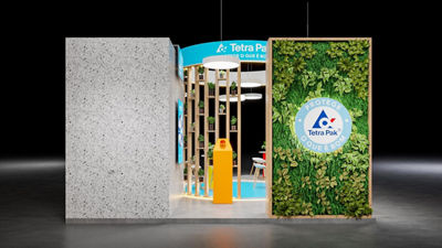 Estande da Tetra Pak, feito com cerca de 80 mil embalagens recicladas, destacando economia circular e sustentabilidade, com parede verde, coleta seletiva, distribuição de água cartonada e Selo Viva Verde pela gestão ambiental exemplar.