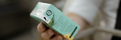 Hand holding recart carton