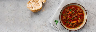 bowl of stew with bread
