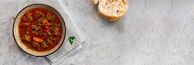 A bowl of stew on a table