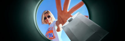 Lady throwing carton in the bin collection and sorting
