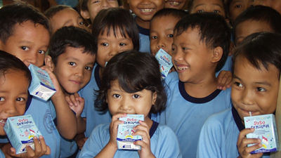 Children drinking milk in Indonesia