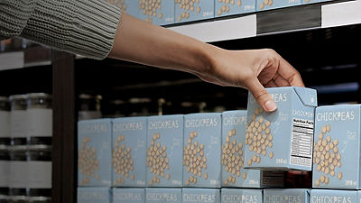 Choosing chick peas in Tetra Recart carton packages