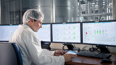 Operator with automation data on screens