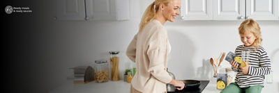 Mother and child cooking in kitchen