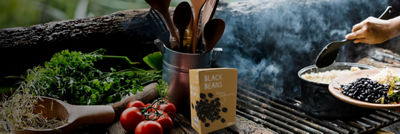 Cooking outdoors with beans on grill