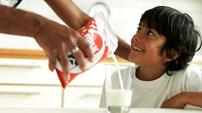 Milk being served from a carton package