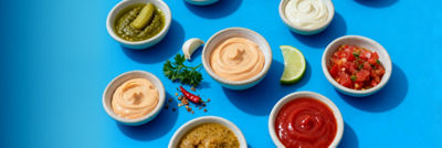 Dressings in bowls, chili and lemon