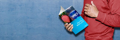 Person holding and reading a Tetra Pak case study about juice producer Jumex