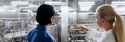 Operators in control room, automation data on screens