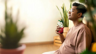 Man enjoying nutrition drink in Tetra Prisma Aseptic carton