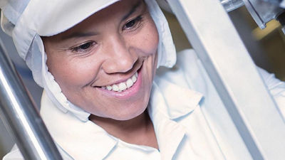 Factory employee working with equipment