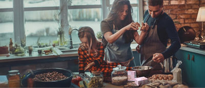 Family cooking dish with beans