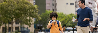 Father and child with drinks on-the-go