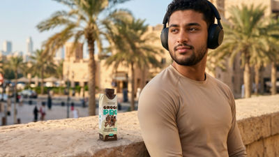 Man exercising on bridge, protein drink in Tetra Prisma Aseptic carton