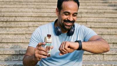 Man exercising on bridge, protein drink in Tetra Prisma Aseptic carton