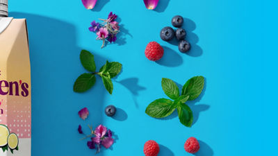 Blueberries, herbs, flowers and a food supplement and nutrition drink.